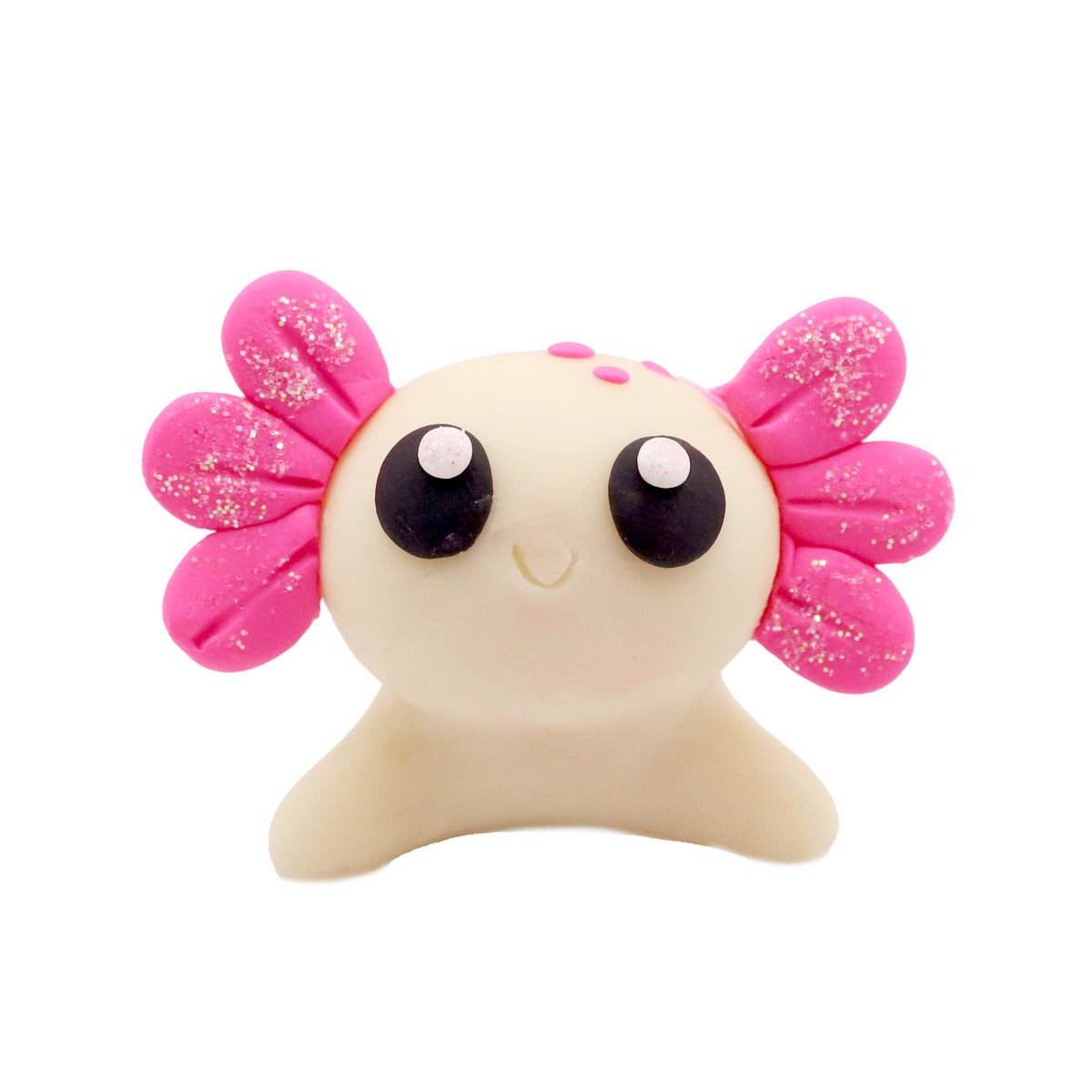 polymer clay axolotl with pink gills and black eyes on a white background