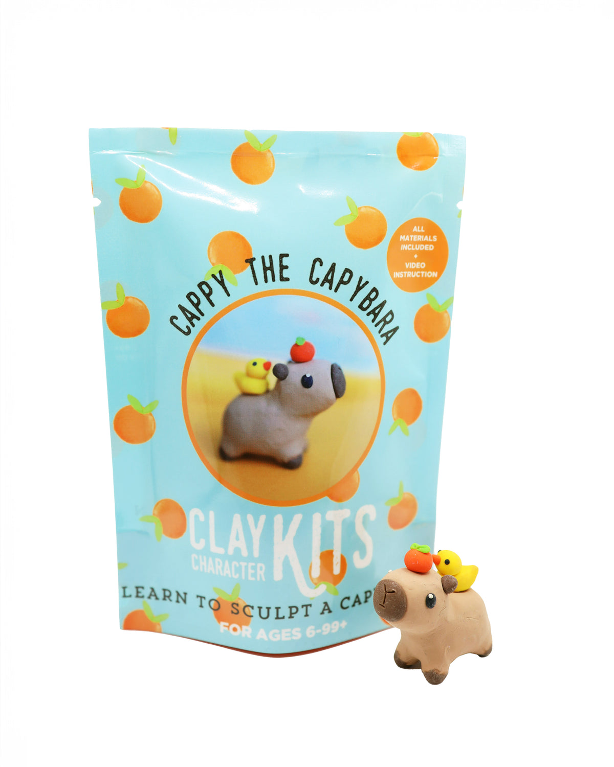 Capybara clay kit with packaging featuring a capybara and orange elements on a white background