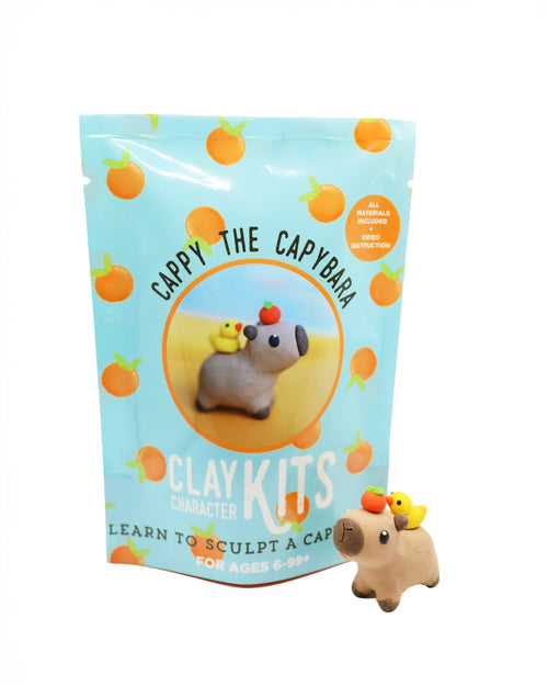 Capybara clay kit with packaging featuring a capybara and orange elements on a white background