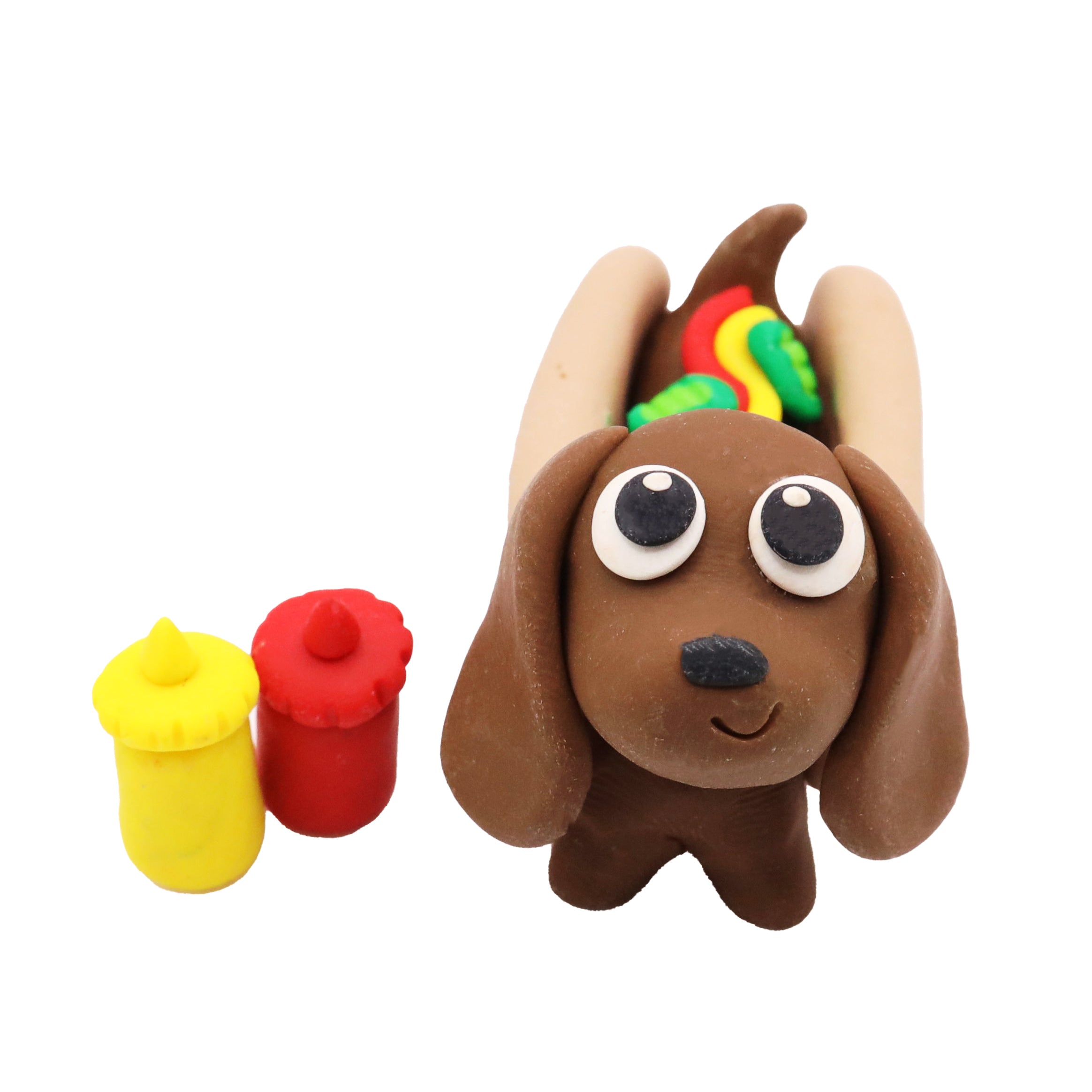 Brown clay dachshund hot dog-shaped with colorful accents on a white background