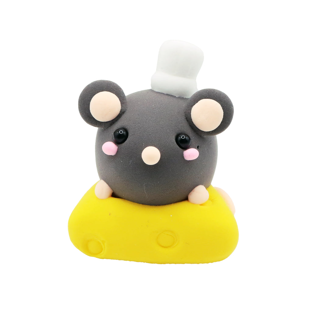 air dry foam clay mouse with a chef's hat on a yellow base against a white background