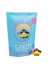 Clay kit packaging with a penguin character on a white background
