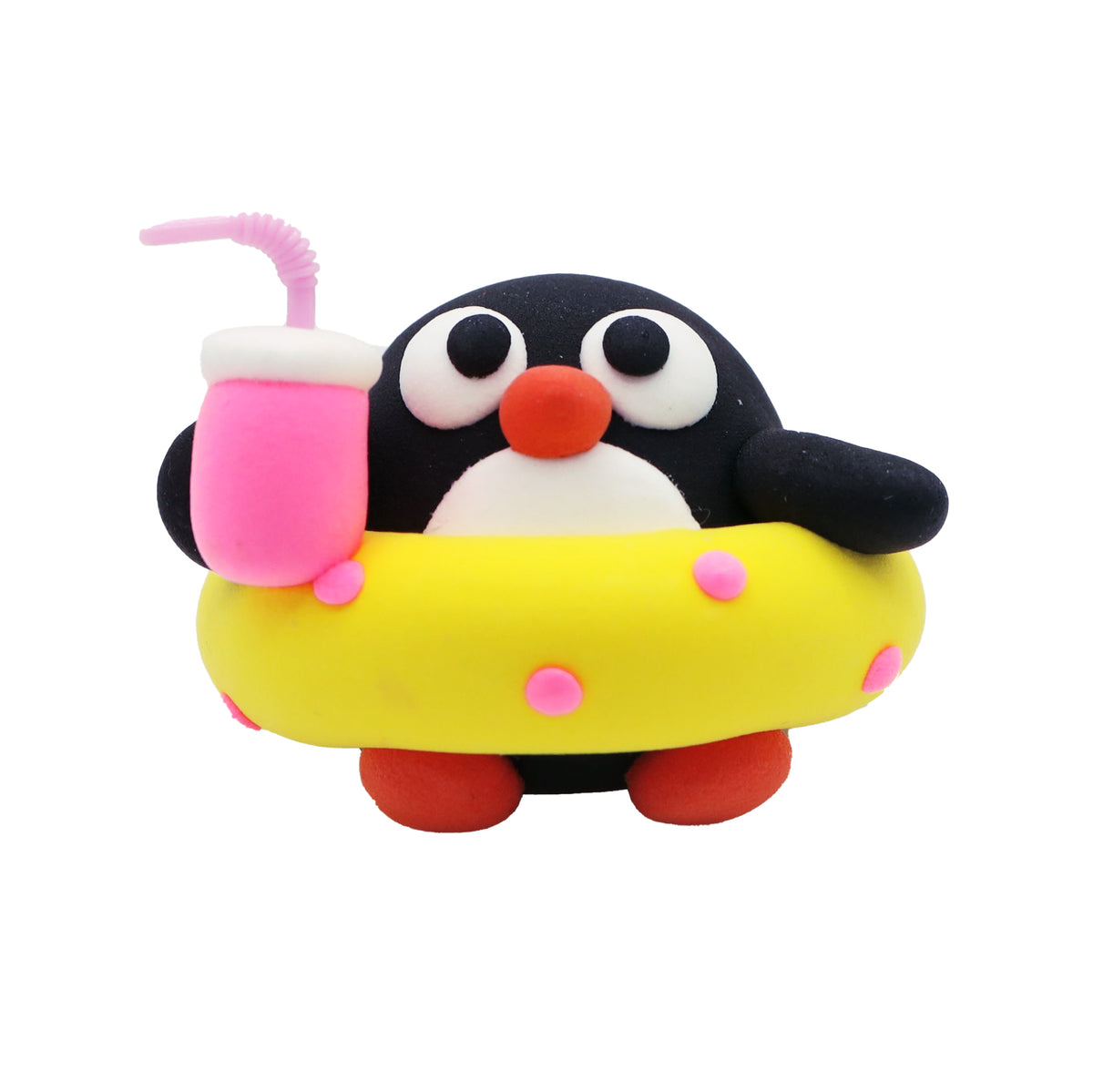 air dry foam clay penguin with a drink and yellow inner tube on a white background
