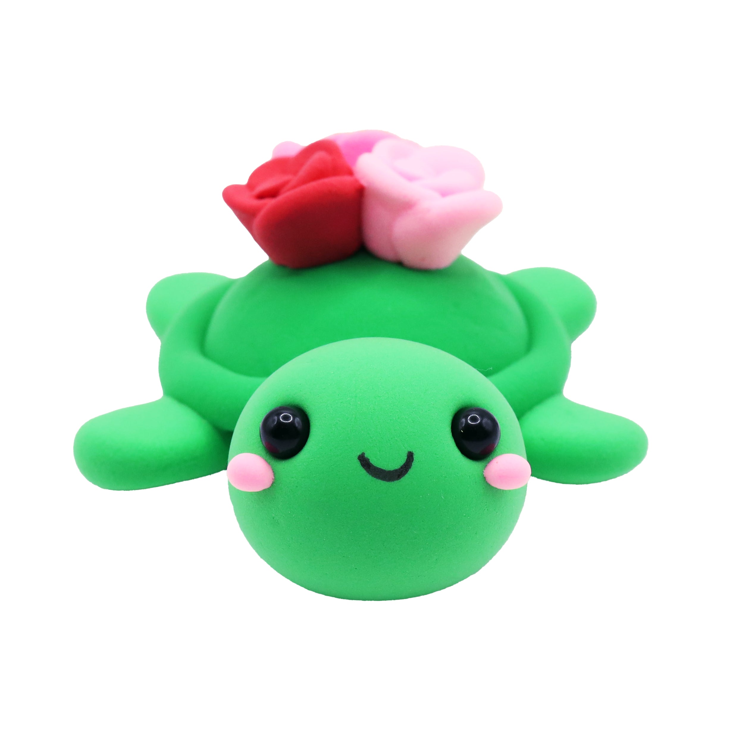 Green turtle air dry foam clay with pink and red flowers on a white background